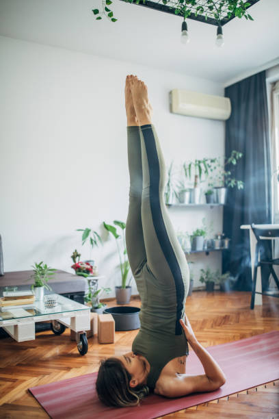 istock Woman lying on upper back and holding her lower back in balance 1249769078