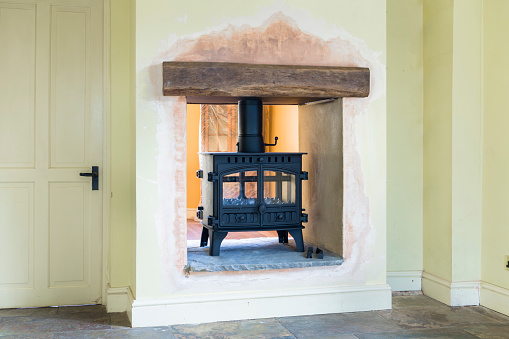 Wood burning stove installation during a UK home remodeling
