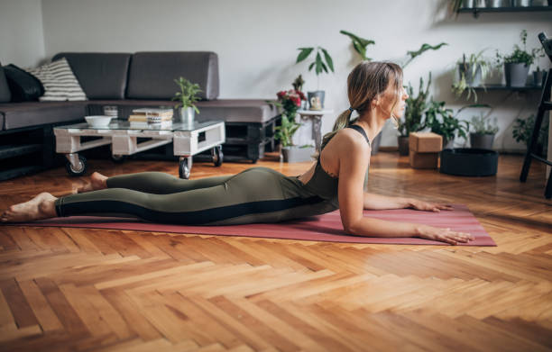 istock One young woman lying in Cobra pose 1249769624