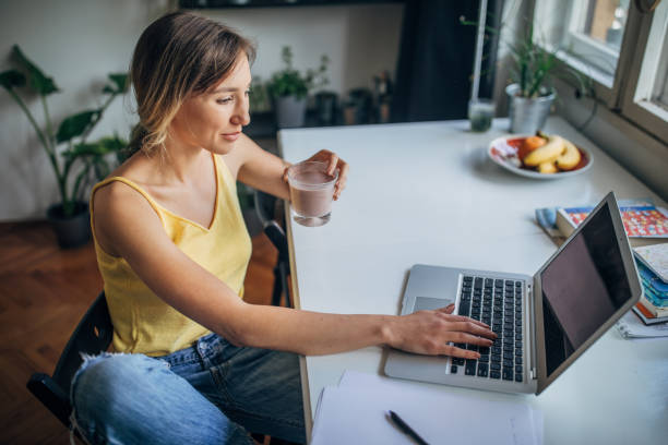 istock One beautiful female student using laptop at home 1249772295