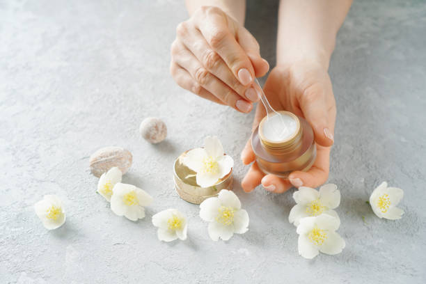 istock Female hands with the cosmetics cream and spoon 1249772523