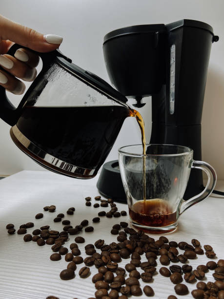 istock Cup of coffee with coffee maker 1249773809