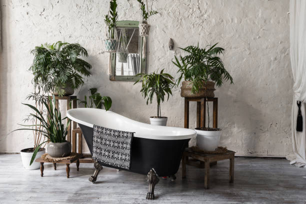 istock Modern bathroom in fashionable interior with elegant bathtub 1249773878