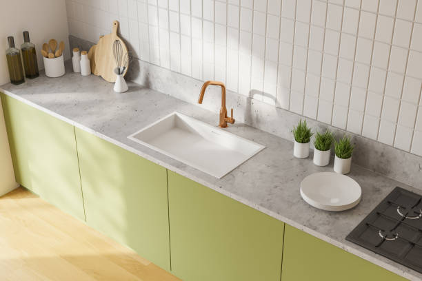 istock Green countertops in white kitchen, top view 1249774078