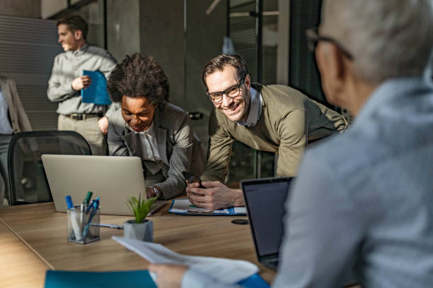 istock Business colleagues talking while working at casual office. 1249774233