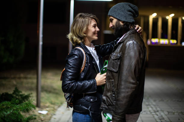 istock Man and woman flirting on a fun date at night 1249775511