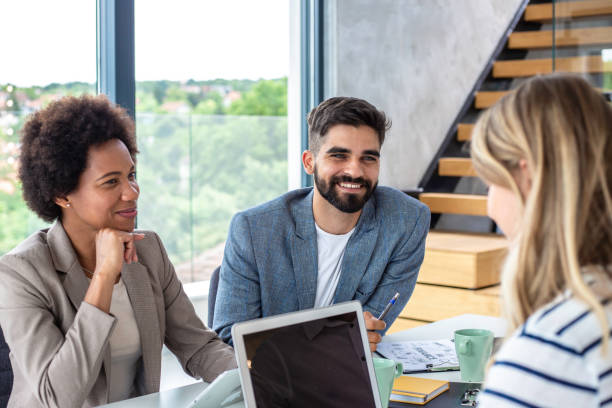 istock Three people working in an office Stock photo 1249776112