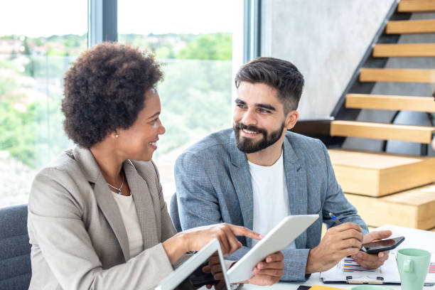 istock Two people working in an office Stock photo 1249776176