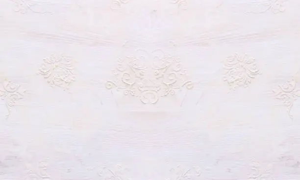 Photo of background of white wooden vintage wall with floral emboss details