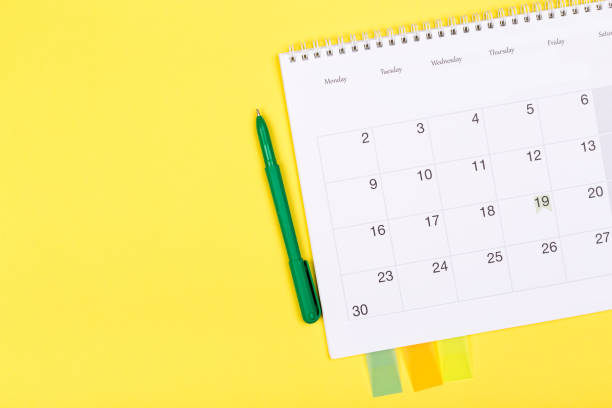 istock White clean calendar 2020  on solid yellow background with copy space, business meeting schedule, travel planning or project milestone and reminder concept. 1249777362
