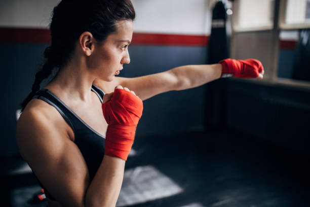 istock Portrait of a female kickboxer exercising 1249778954