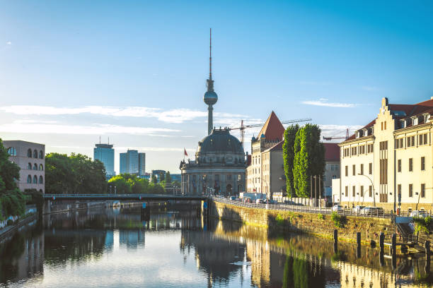 istock view on Berlin cityscape reflecting in river at sunrise hour 1249779218