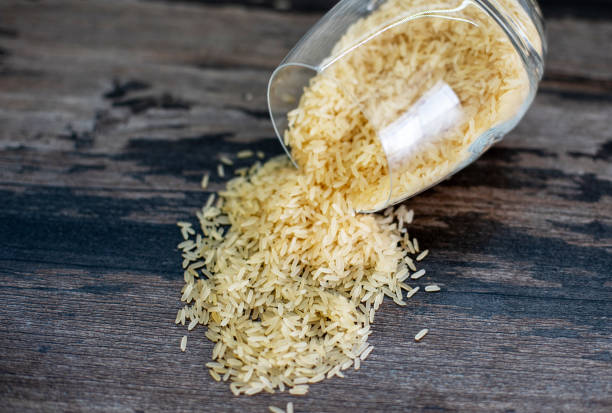 istock Golden rice is scattered on the table 1249781138