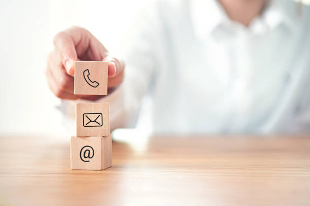 istock CONTACT US, Businessman hand holding ( mail,phone,email ) icon. cutomer support concept. 1249787971