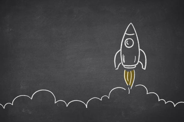 istock Business Startup Concept with Spaceship on Blackboard 1249788805