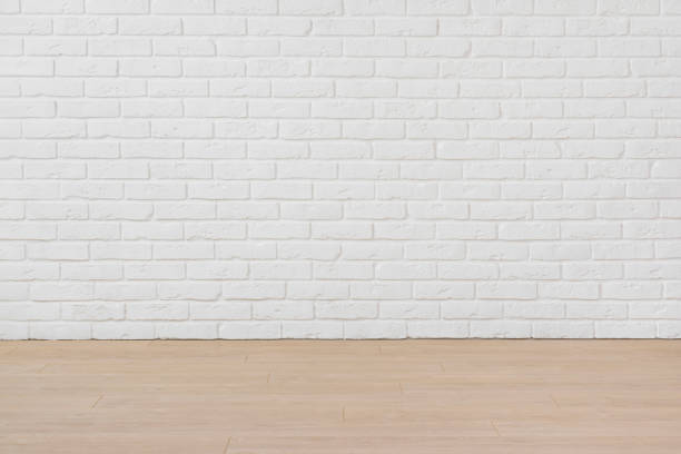 Empty room with white brick wall and laminated flooring board Empty room with white brick wall and laminated flooring board parquet floor perspective stock pictures, royalty-free photos & images