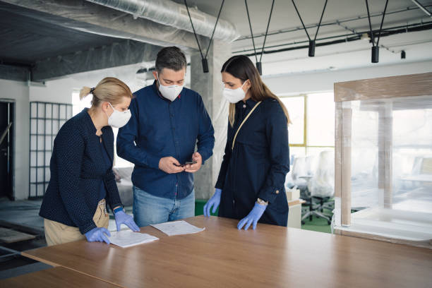 istock A team of young architects discusses the project on the construction site 1249791141