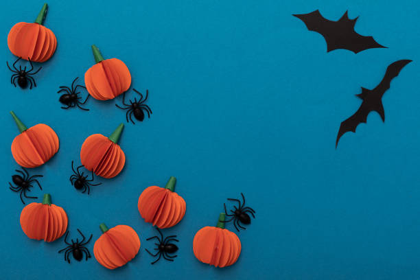 istock Modern black and orange invitation card on blue background. Halloween concept 1249792037