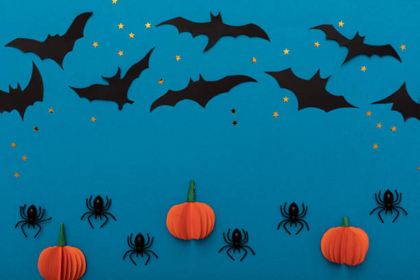 istock Modern black and orange invitation card on blue background. Halloween concept 1249792095