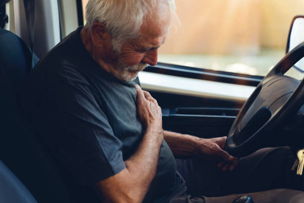 istock Senior old man suffering from heart attack in car 1249792190