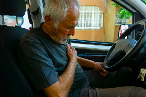 istock Senior man suffering from heart attack in car 1249792273