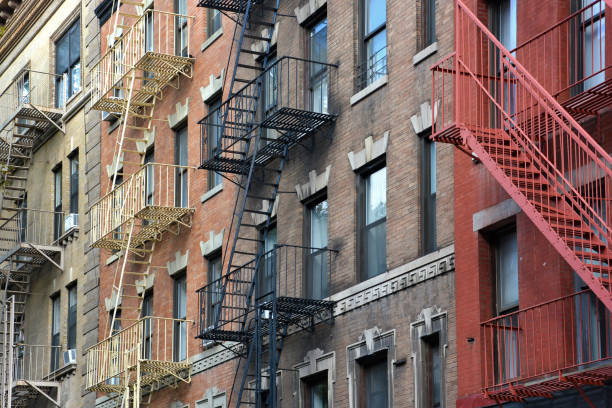 istock Low angle view of typical cast iron buildings with fire escape ladders in SoHo district, New York City, USA 1249794347