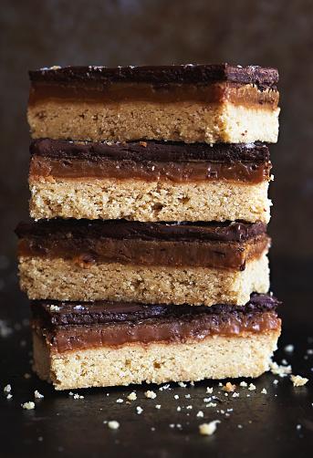 Chocolate caramel shortbreads stacked, four pieces
