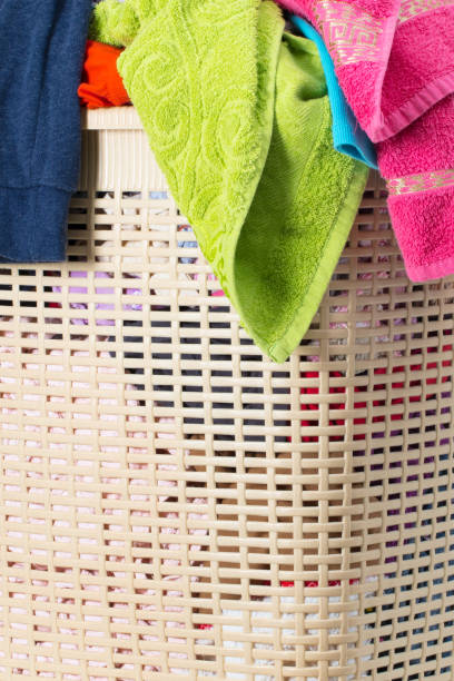 istock Laundry basket full of dirty washing 1249798892