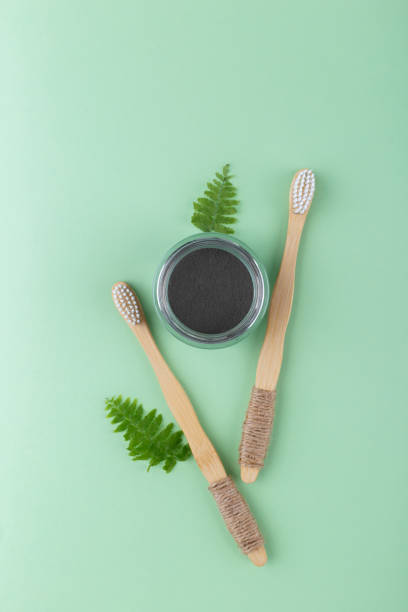 istock Natural bamboo tooth brushes and black dental powder 1249799632
