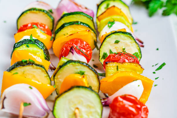 istock Grilled vegetable skewers on gray rectangular plate. Vegan food concept. 1249801527