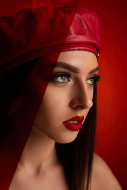 istock woman in red leather beret 1249802226