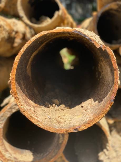 Lead Pipes Lead pipe removal in Flint, Michigan graphite stock pictures, royalty-free photos & images