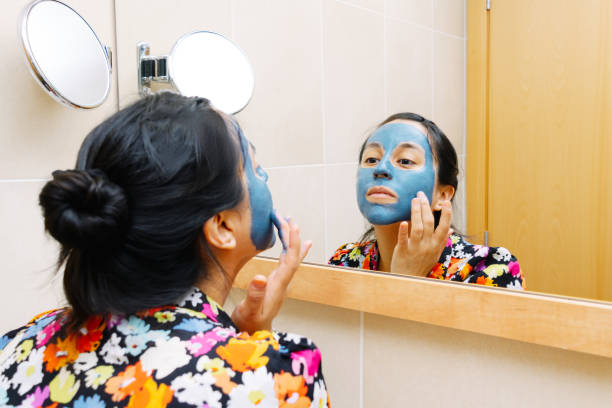 istock Woman with blue beauty mask 1249804463