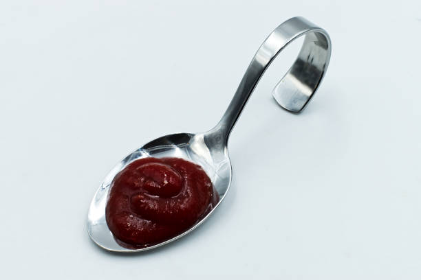 istock Fresh ketchup isolated on white background 1249806730