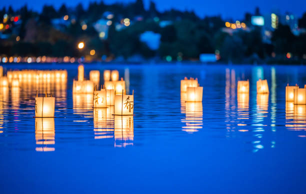 lantern floating on green lake park for memorial of Hiroshima,Wa,usa lantern floating on green lake park for memorial of Hiroshima,Wa,usa.. lanterns at night stock pictures, royalty-free photos & images
