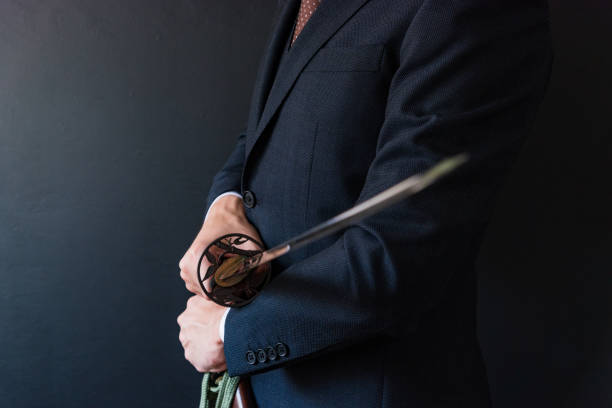 istock The man holding japanese sword 1249808382