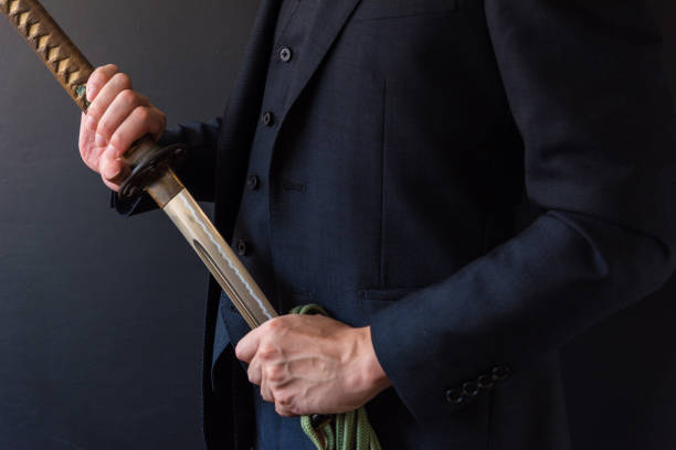 istock The man holding japanese sword 1249808645