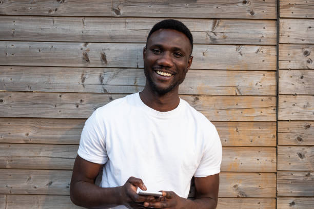 istock Handsome Black Man Smiling Toothy Smile at Camera 1249808703