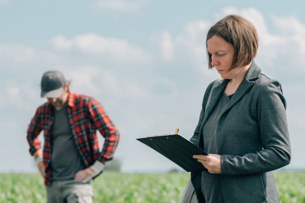 istock Mortgage loan officer assisting farmer in financial allowance application process 1249809337