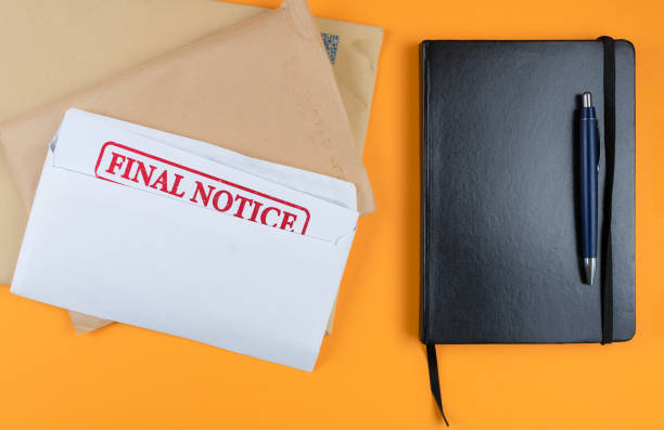 istock final notice letter with other mail on desk 1249809526