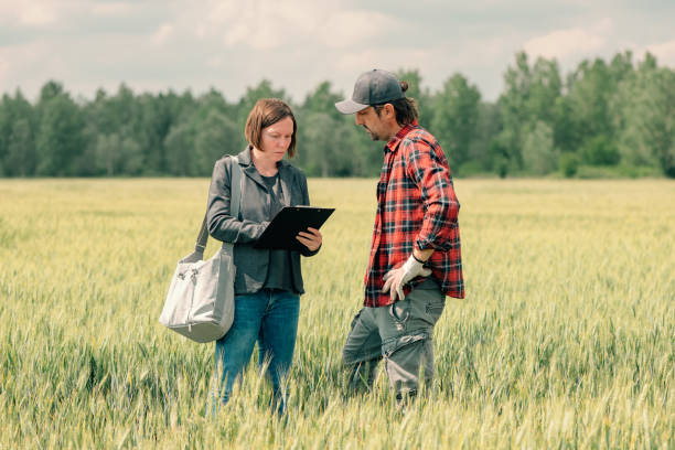 istock Mortgage loan officer assisting farmer in financial allowance application process 1249809536