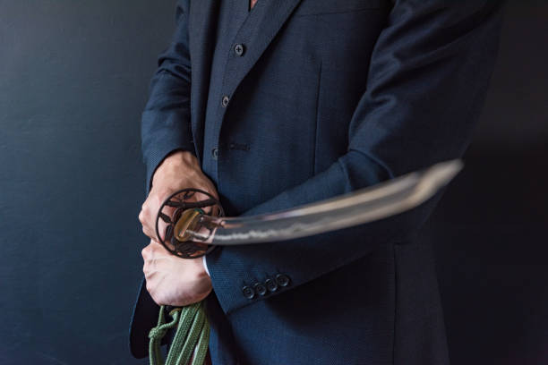 istock The man holding japanese sword 1249811215
