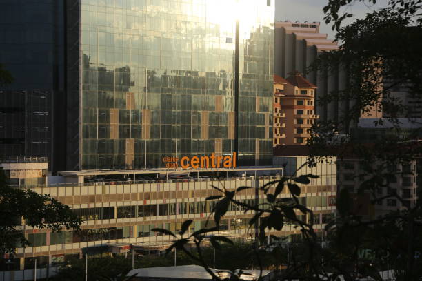 istock Sunset reflecting off a modern glass building 1249811352