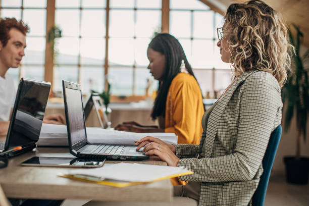 istock Multi ethnic diverse business people working together in small modern office 1249811568