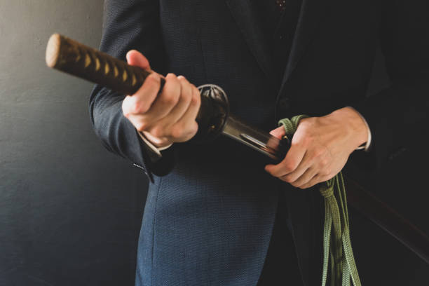istock The man holding japanese sword 1249813103