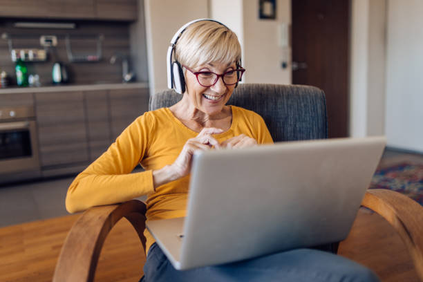 istock Senior woman teaching online from home 1249813213