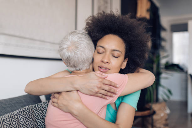 istock Daughter hugging her mother on mother's day 1249813410