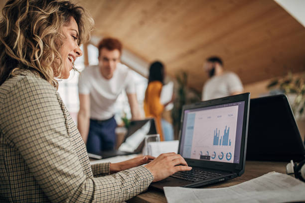 istock Beautiful businesswoman using laptop at work 1249813553