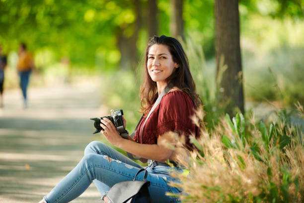 istock quiet sitting in the park with a camera 1249813683