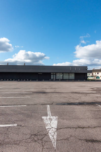 istock Cracked tarmac desolate supermarket 1249816543